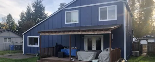 about-us-providing-excellent-local-service-blue-house-exterior